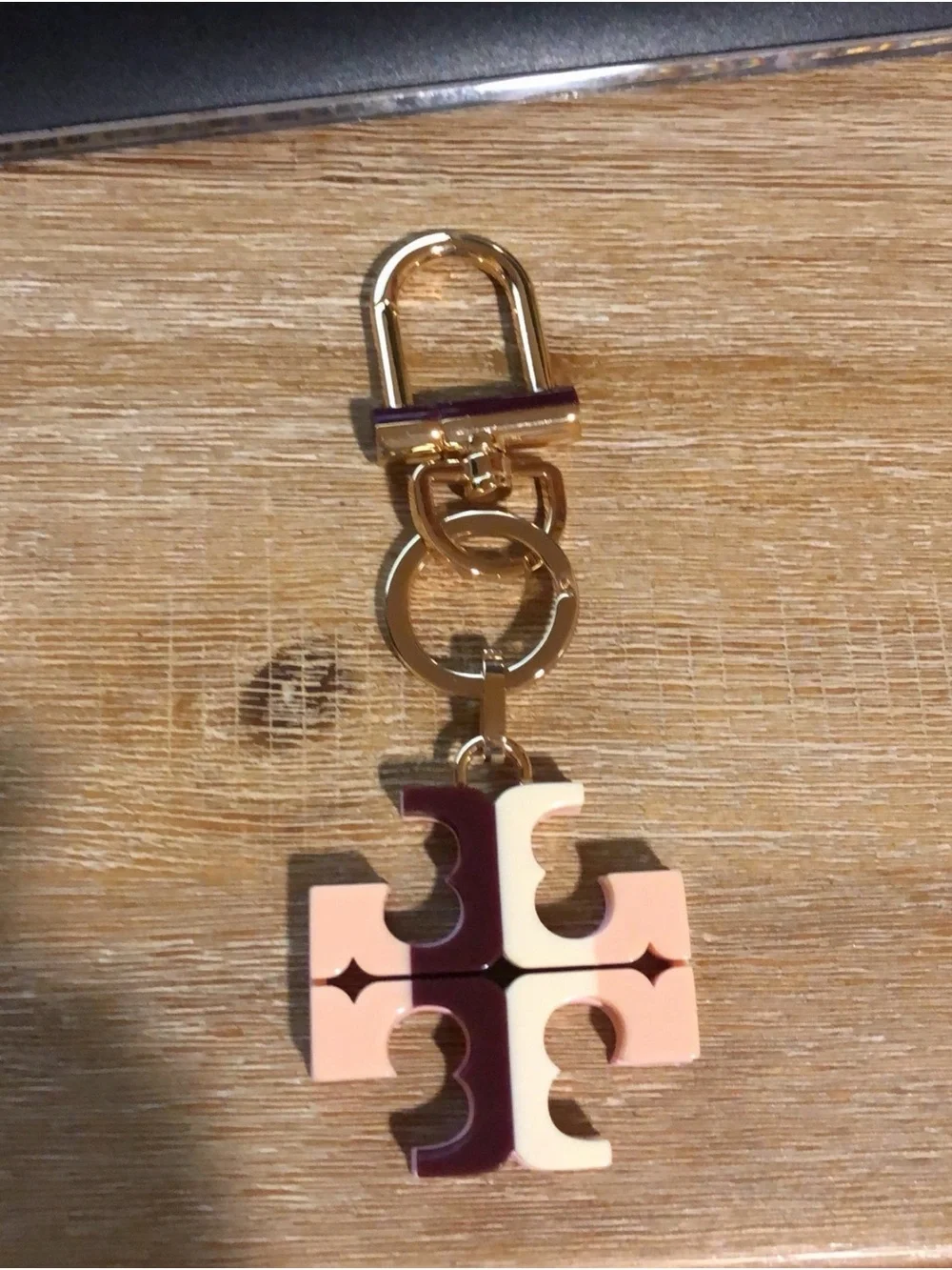 Tory Burch Gold Tone Key Fob with Pink and Cream Logo Charm